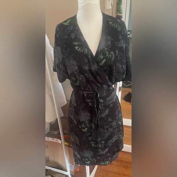 Babaton Dresses & Skirts - Babaton Black Floral Wrap Dress with Green Accents